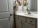 Clean bathroom with modern vanity, white cabinetry, and a well-lit mirror at 133 Sandcastle Ln, Four Oaks, NC 27524