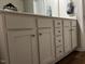 Bathroom vanity featuring cabinets and stainless steel hardware at 133 Sandcastle Ln, Four Oaks, NC 27524