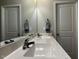 Bathroom vanity featuring a double sink and cabinet storage below at 133 Sandcastle Ln, Four Oaks, NC 27524