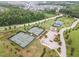 Aerial image of tennis courts with lush green surroundings at 183 Post Oak Rd, Chapel Hill, NC 27516