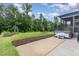 Secluded backyard oasis with a hot tub, screened in porch, and mature trees at 183 Post Oak Rd, Chapel Hill, NC 27516