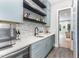 Stylish bar area with custom cabinetry, a beverage fridge, and a sink for entertaining at 183 Post Oak Rd, Chapel Hill, NC 27516