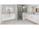 Modern bathroom features a glass shower, granite counters, dual vanities, and access to walk-in closet at 183 Post Oak Rd, Chapel Hill, NC 27516