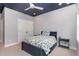 Cozy bedroom with modern decor, carpeted floor, and a navy blue accent ceiling at 183 Post Oak Rd, Chapel Hill, NC 27516