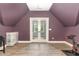 Spacious bonus room with wood look flooring, and a walk out to a balcony at 183 Post Oak Rd, Chapel Hill, NC 27516