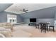 Spacious bonus room featuring neutral decor, a large TV, and a comfortable sectional sofa at 183 Post Oak Rd, Chapel Hill, NC 27516