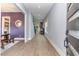 Open foyer with hardwood floors, modern lighting, and views into the dining room and living area at 183 Post Oak Rd, Chapel Hill, NC 27516