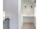 Bright nook features a shelf, lighting, adjacent to an onyx lamp on a painted dresser at 183 Post Oak Rd, Chapel Hill, NC 27516