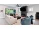 Modern living room with black fireplace, tile surround, recessed lighting, and an open floorplan at 183 Post Oak Rd, Chapel Hill, NC 27516