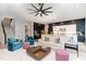 Bright, open-concept living room with modern furniture, hardwood floors, and a view of the kitchen at 183 Post Oak Rd, Chapel Hill, NC 27516