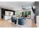 Open-concept living room with modern furniture, hardwood floors, and seamless flow to the kitchen at 183 Post Oak Rd, Chapel Hill, NC 27516
