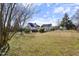 Expansive backyard with lush lawn, gazebo, and mature trees, perfect for outdoor enjoyment at 20 Jenmar Dr, Fuquay Varina, NC 27526