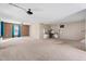 Large basement with multiple areas, including a brick accent wall and a built-in desk at 20 Jenmar Dr, Fuquay Varina, NC 27526
