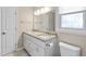 Bathroom featuring double sinks, granite countertops, and a large mirror at 20 Jenmar Dr, Fuquay Varina, NC 27526