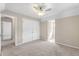This bedroom features neutral walls, ceiling fan, and double-door closet at 20 Jenmar Dr, Fuquay Varina, NC 27526