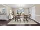 Dining room featuring stylish dining set, chandelier, and natural light at 20 Jenmar Dr, Fuquay Varina, NC 27526