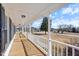 Long covered front porch with white railings, perfect for relaxing at 20 Jenmar Dr, Fuquay Varina, NC 27526