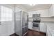 Bright kitchen with stainless steel appliances, granite countertops, and a door leading to the outside at 20 Jenmar Dr, Fuquay Varina, NC 27526