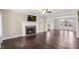 Spacious living room with a cozy fireplace and hardwood flooring at 20 Jenmar Dr, Fuquay Varina, NC 27526