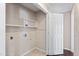 Utility room with shelving and tile flooring at 20 Jenmar Dr, Fuquay Varina, NC 27526