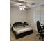 The bedroom has a ceiling fan and a cozy setup with a window view, perfect for a gamer at 2002 Technology Woods Drive # 103, Raleigh, NC 27603