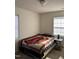Comfortable bedroom bathed in natural light from two windows, creating a relaxing ambiance for rest and rejuvenation at 2002 Technology Woods Drive # 103, Raleigh, NC 27603