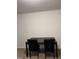 Cozy dining area set up with a table and chairs against a blank wall, ready for personalized decoration at 2002 Technology Woods Drive # 103, Raleigh, NC 27603
