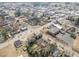 A bird's eye view showcases a neighborhood with a home, surrounded by trees and streets at 202 W Hill St, Benson, NC 27504