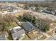 Aerial view of a home with a cozy front porch, swing, and well-kept yard at 202 W Hill St, Benson, NC 27504