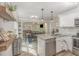 Open kitchen and dining area, showcasing modern appliances, granite countertops, and stylish decor at 202 W Hill St, Benson, NC 27504
