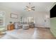 Bright living room featuring a comfortable sofa, ample natural light, and stylish decor at 202 W Hill St, Benson, NC 27504