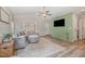 Cozy living room with a comfy couch, vaulted ceiling, and large TV, perfect for relaxing at 202 W Hill St, Benson, NC 27504