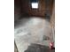 Basement with wooden walls and unfinished concrete floor, offering potential for customization at 208 Essex Rd, Nashville, NC 27856