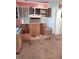 Kitchen with unfinished cabinets and laminate flooring, primed for customization at 208 Essex Rd, Nashville, NC 27856
