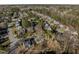 Neighborhood aerial showcasing home with approximate property lines in a community with mature trees at 215 Longbridge Dr, Cary, NC 27518