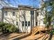 Two-story home showcasing a wooden deck, bright windows, and neutral siding at 215 Longbridge Dr, Cary, NC 27518