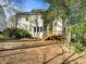 Two-story home showcasing a wooden deck, bright windows, and neutral siding at 215 Longbridge Dr, Cary, NC 27518