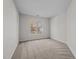 Neutral bedroom offers a large window providing plenty of natural light and plush carpeting at 215 Longbridge Dr, Cary, NC 27518
