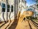 Side view of a wooden deck with stairs, perfect for outdoor relaxation and entertaining at 215 Longbridge Dr, Cary, NC 27518