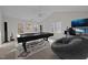 Recreation room with pool table, gaming chair, and large monitor perfect for entertaining at 215 Longbridge Dr, Cary, NC 27518