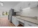 Bright kitchen with white cabinets, stainless steel appliances, and granite countertops at 215 Longbridge Dr, Cary, NC 27518