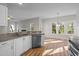 Modern kitchen with stainless steel appliances, granite countertops, and lots of natural light at 215 Longbridge Dr, Cary, NC 27518