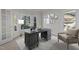 Comfortable home office with a large wooden desk, modern decor, and lots of natural light at 215 Longbridge Dr, Cary, NC 27518