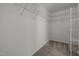Walk-in closet featuring neutral carpet and wire shelving at 215 Longbridge Dr, Cary, NC 27518