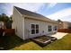 Spacious backyard featuring a concrete patio and garden beds at 2344 Lazy River Dr, Raleigh, NC 27610