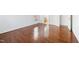 Bedroom with wood floors, a bright window, and an ensuite bathroom at 2344 Lazy River Dr, Raleigh, NC 27610