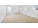 Spacious bedroom with three windows that allow for lots of natural light at 2344 Lazy River Dr, Raleigh, NC 27610