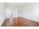 The bedroom has wood floors, a window, and a double-doored closet at 2344 Lazy River Dr, Raleigh, NC 27610