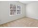 Bedroom contains a large window that offers relaxing views of the property at 2344 Lazy River Dr, Raleigh, NC 27610