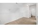 Carpeted bedroom includes an attic space and a door to a full bathroom at 2344 Lazy River Dr, Raleigh, NC 27610
